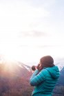 Girl taking shots of mountains — Stock Photo