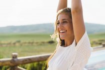 Pretty smiling woman in countryside — Stock Photo