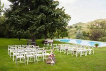 Rows of chairs in garden — Stock Photo