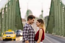 Young loving couple hugging in the street. — Stock Photo