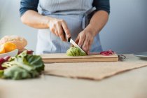 Cook chopping avocado — Stock Photo