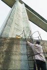 Man climbing stairs of tower — Stock Photo