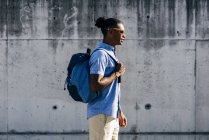 Man walking with backpack — Stock Photo
