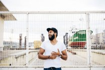 Bearded man laughing and looking away — Stock Photo