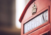 Crop red call-box with crown and lettering — Stock Photo