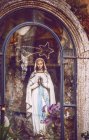Virgin Mary statue behind glass — Stock Photo
