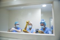 Front view of doctors in ,asks washing hands before operation — Stock Photo