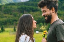 Couple looking at each other on meadow — Stock Photo
