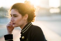 Side view of young woman wearing casual clothes and looking away — Stock Photo