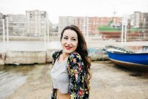 Brunette girl posing at wharf — Stock Photo