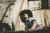 Low angle portrait of expressive afro girl — Stock Photo