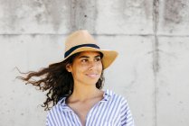 Girl in hat looking aside — Stock Photo