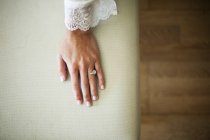 From above shot of woman in peignoir showing engagement ring — Stock Photo