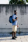 Man posing with backpack — Stock Photo