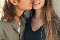 Crop of smiling couple touching face to face. — Stock Photo
