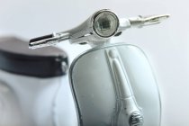 Cropped image of vintage white scooter — Stock Photo