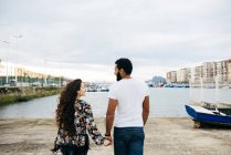 Couple walking at wharf — Stock Photo