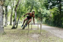 Man exercising in park — Stock Photo