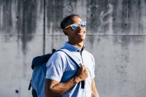 Man posing with backpack — Stock Photo