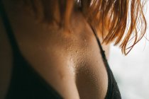 Midsection of redhead girl in black bra — Stock Photo