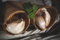 Still life of garlic in waffle cones — Stock Photo
