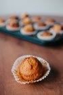 Close up view of homemade muffins with chocolate in wrapper — Stock Photo