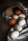 Close up chicken eggs on towel at table — Stock Photo