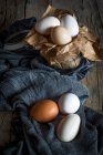 Still life of chicken eggs on rural fabric — Stock Photo