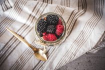 Jar with yogurt and berries — Stock Photo