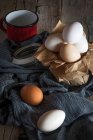 Still life of chicken eggs on rural table — Stock Photo