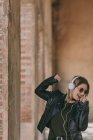 Girl dancing in headphones — Stock Photo