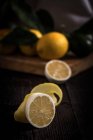 Peeled lemon with citrus fruits — Stock Photo