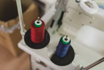 Close up view of red and blue spools on spires — Stock Photo