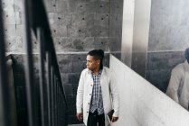 Man wearing coat and looking away — Stock Photo