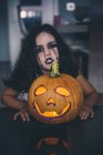 Girl with pumpkin lattern — Stock Photo