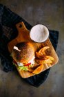 Vegetarian burger and glass of beer — Stock Photo