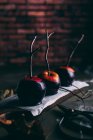 Row of halloween caramel apples — Stock Photo