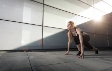 Sportswoman on crouch start — Stock Photo