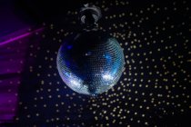 Disco ball over dark wall — Stock Photo