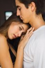 Portrait of young couple embracing sensually — Stock Photo
