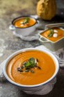 Close up view of cream of pumpkin in ceramic bowls — Stock Photo