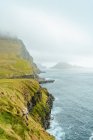 Scenic view of cliffs above rough ocean — Stock Photo