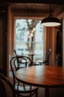 Cozy tables and chairs in interior of restaurant — Stock Photo