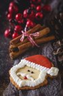Still life of Santa Claus cookie and Christmas decorations — Stock Photo