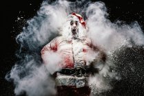 Astonished Santa Claus in snow cloud — Stock Photo