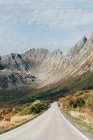 Scenic view of asphalt road in picturesque mountains. — Stock Photo