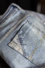Close up view of light blue jeans pockets. — Stock Photo