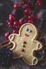 Still life of ginger man cookie and Christmas decorations — Stock Photo