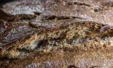 Full frame shot of home-made bread on table rustic. — Stock Photo