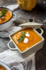Close up view of cream of pumpkin in bowls on white gauze — Stock Photo
